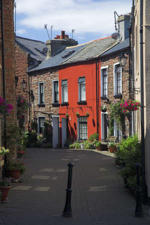 Old houses in street at Peel Isle of Manの写真素材