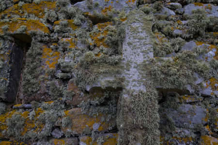 Lichen covered cross and wall at Tobha Morの写真素材