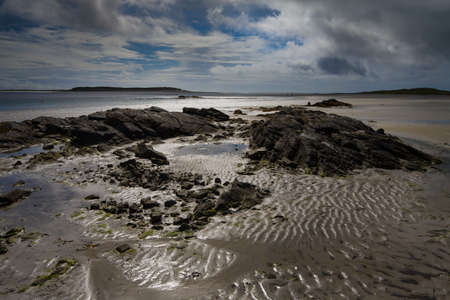 Sandy beach and rocks in North Uist in the Outer Hebridesの写真素材