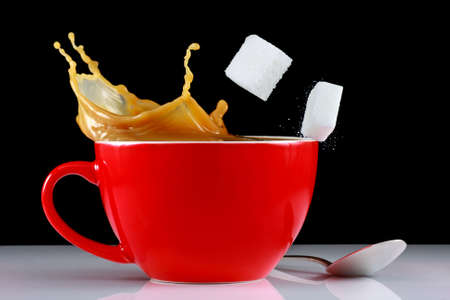 Coffee splash with sugar cubesの写真素材