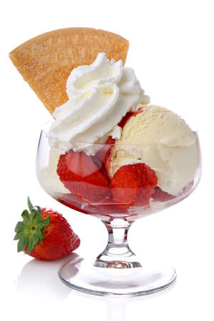 Ice cream with strawberries and whipped creamの写真素材