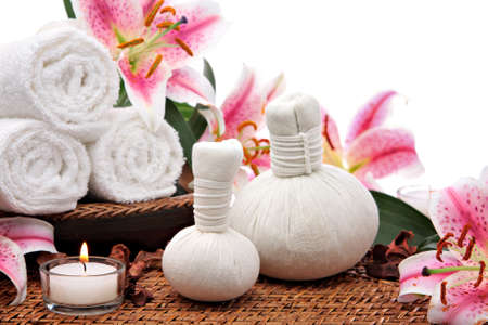 Massage setting with towels spa compress balls and flowersの写真素材