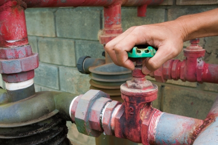 Hand open tap with running waterの写真素材