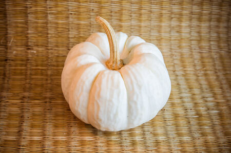 pumpkin in wicker backgroundの写真素材