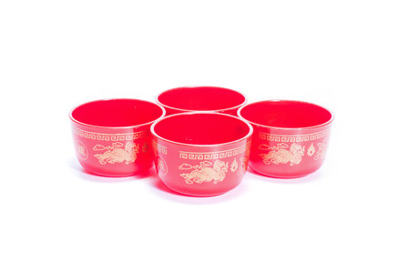 red cups of Chinese tea set. Isolated on white.の写真素材