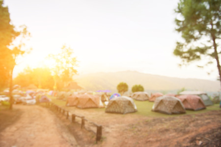 Blurred Camping site and sunrise backgroundの写真素材