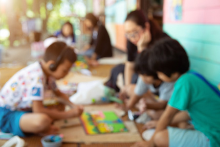 Blur image of teacher teaching art students.の写真素材