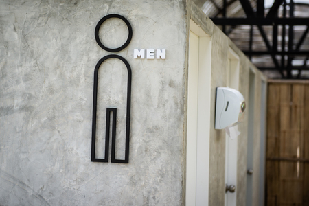 toilet point symbol on wall grey color make with black steelの写真素材