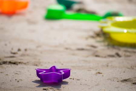 kids toys on sand beachの写真素材