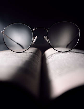 glasses on book, reading open your mindの写真素材