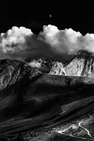 black and white. wolking through the dolomites mountains Piz BoÃ¨. moon view.の写真素材