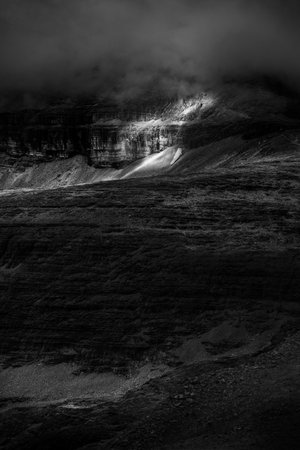 black and white. wolking through the dolomites mountains Piz BoÃ¨. moon view.の写真素材