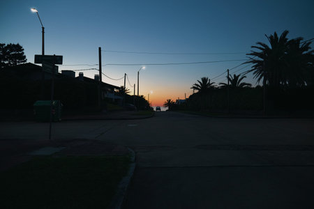 Beautiful orange sunset view walking down the Streets at Punta del Este, Uruguay.の写真素材