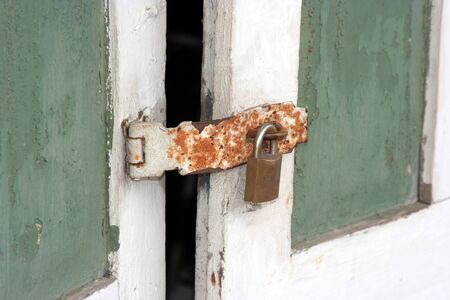 Old rusted lock on a doorの写真素材