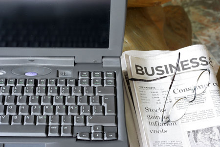 Laptop and Newspaper