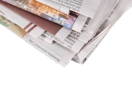 a pile of newspapers isolated on a white backgroundの写真素材