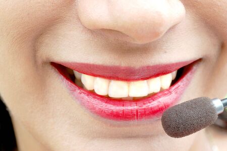 Girl talking on line and smilingの写真素材