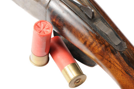 Macro shot of a shtgun and shells on white
