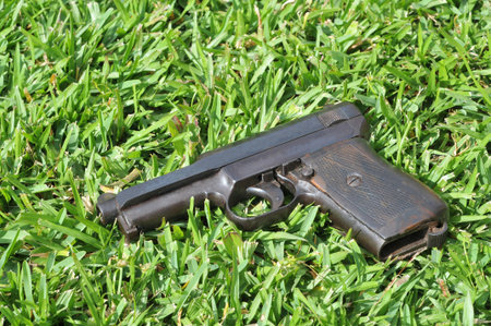 Old gun on a grass field