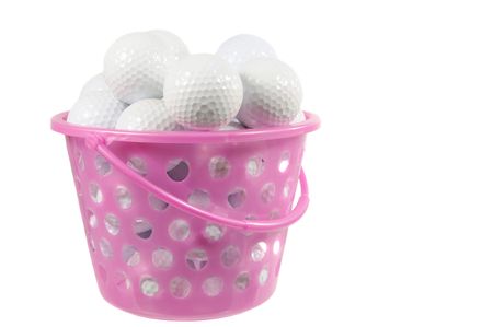 Bucket with golf balls isolated on whiteの写真素材