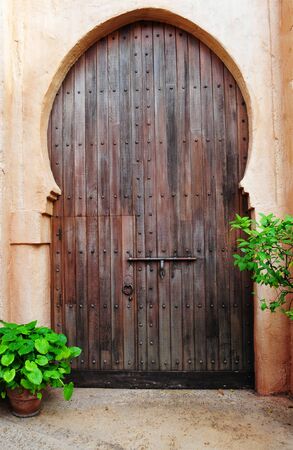 Beautiful wooden door on a midlle eastern bulding entranceの写真素材