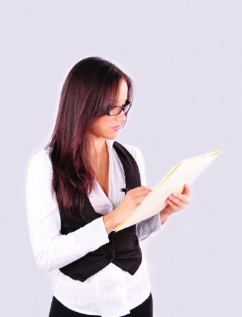 Young executive signing some paper workの写真素材