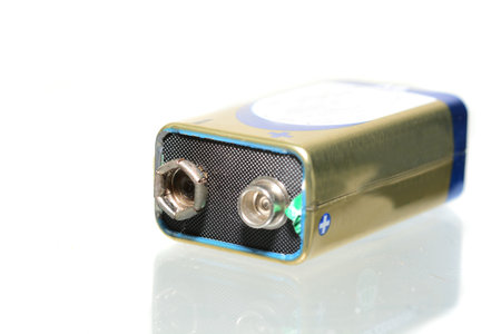 Macro shot of a single 9 volts battery on white
