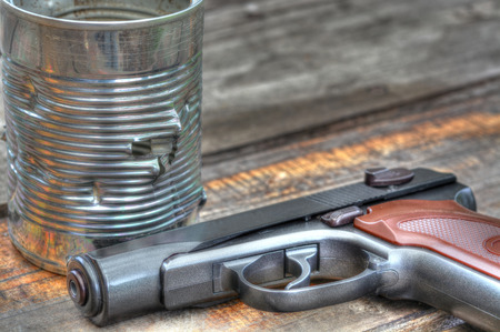 Tin can full of holes from a BB gun fireの写真素材