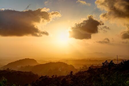Beautiful yellow and orange sunset in the mountains of Panamaの写真素材