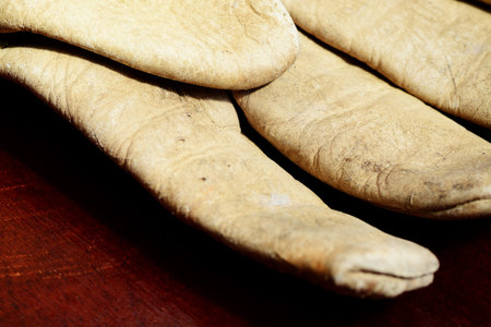Macro shot of an old leather working gloveの写真素材