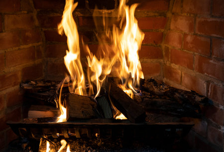Close up view of a fireplace fire burning