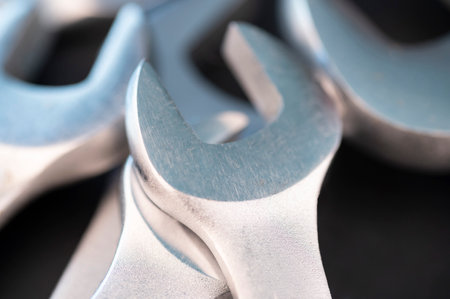 Close up shot of several spanner wrenches on a blackk backgroundの写真素材
