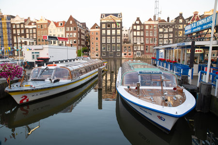 AMSTERDAM-HOLLAND- JULY 29, 2019: Amsterdam is one of the largest river cruise ports in Northwestern Europe.の写真素材