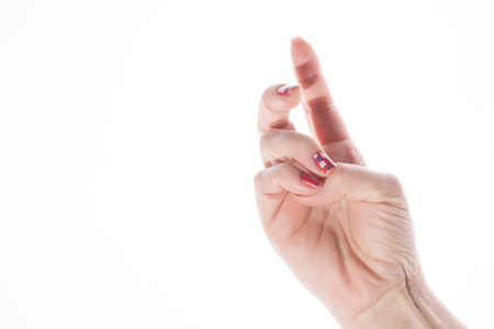 Hand shows a sign on a white backgroundの写真素材