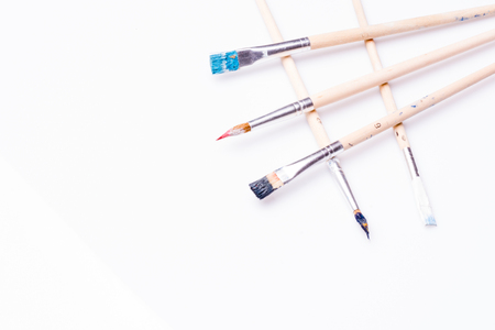 Different types of paint brushes on a white backgroundの写真素材