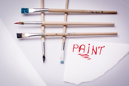 Different types of paint brushes on a white backgroundの写真素材