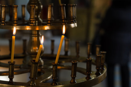 Religious church candle in temple for prayerの写真素材