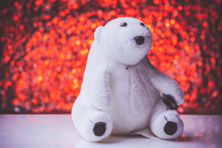Teddy Bear toy alone on  wooden floor with nice bokeh backgroundの写真素材