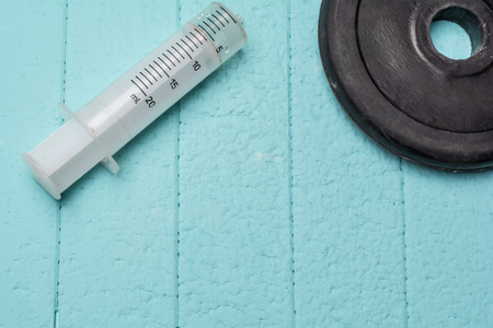 Injection and disc from dumbbell. Close up.の写真素材