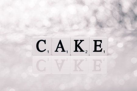 Created word of tiles with letters - cakeの写真素材