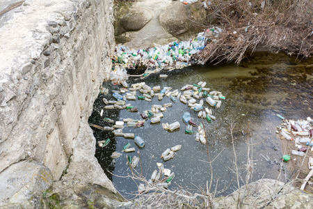 Rubbish pollution with plastic and other garbage in the riverの写真素材