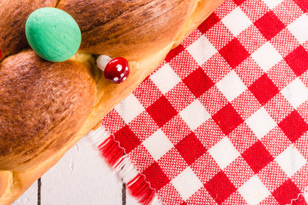Homemade Easter bread on a white wooden background