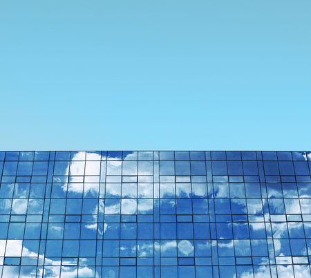 Business building, blue sky and windows concept