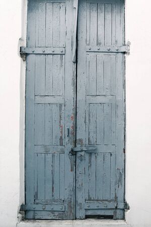 Old wooden gray textured door, urban grunge backgroundの写真素材