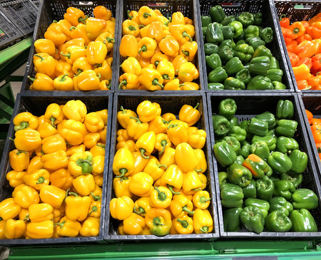 Different peppers yellow and green lying in boxes in supermarket
の写真素材
