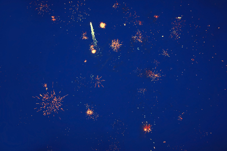 Holidays, celebration concept - fireworks on sky backgroundの写真素材