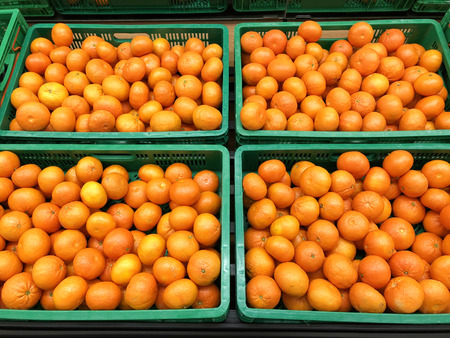 lot of tangerines in the boxes close-upの写真素材