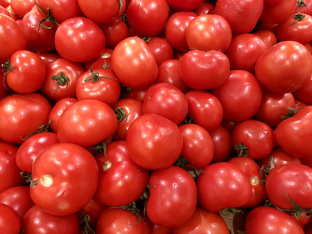 Healthy eating, vegetarian food concept - close up sweet red tomatoesの写真素材
