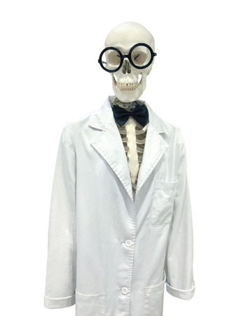 Funny skeleton doctor in scientific lab gown isolated on white backgroundの写真素材