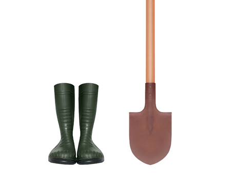 Rubber boots and shovel isolated on white backgroundの写真素材